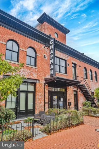 a living room with furniture a window and a table