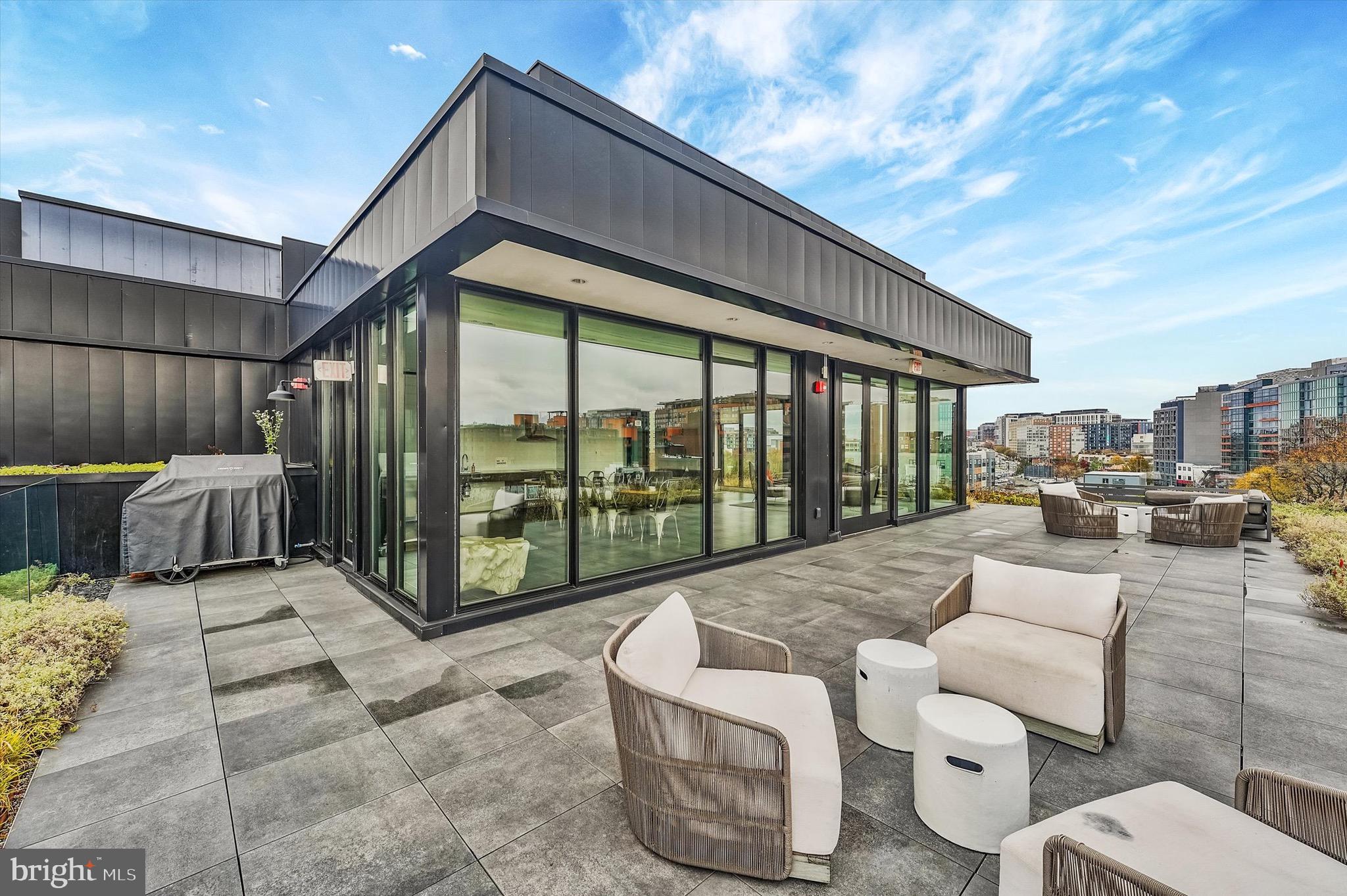 57 N Street Northwest, Unit 125 Washington, DC 20001 - Photo 36 of 56 a balcony with couple of cars parked in front of it