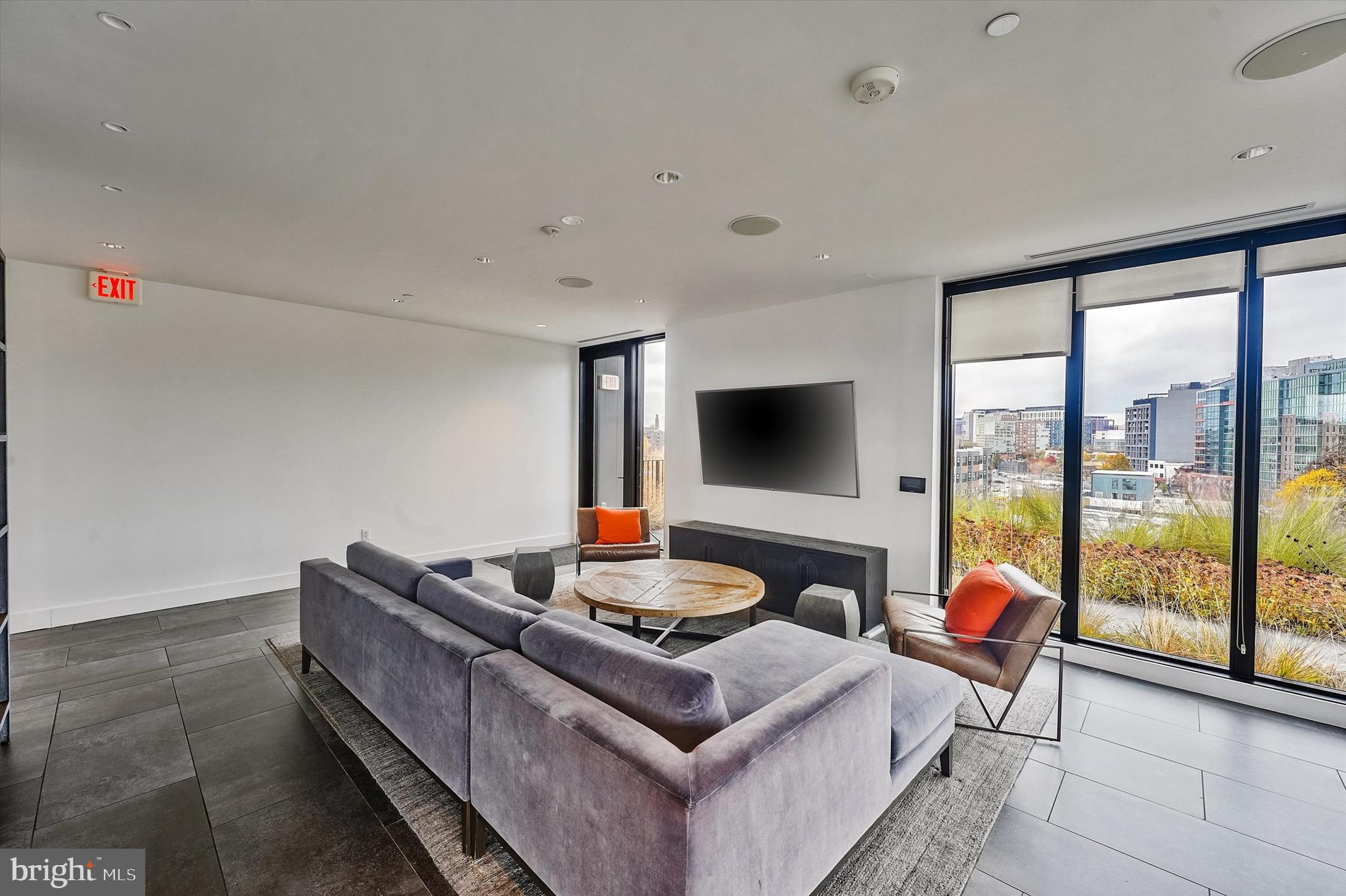 57 N Street Northwest, Unit 125 Washington, DC 20001 - Photo 40 of 56 a living room with furniture and a flat screen tv