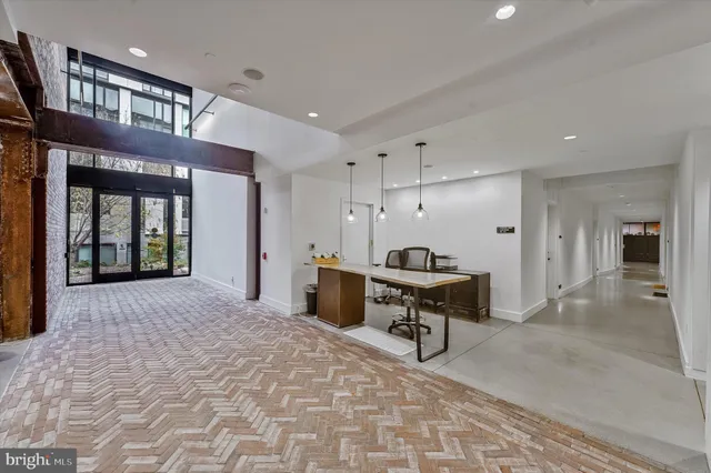 a living room with furniture and white walls