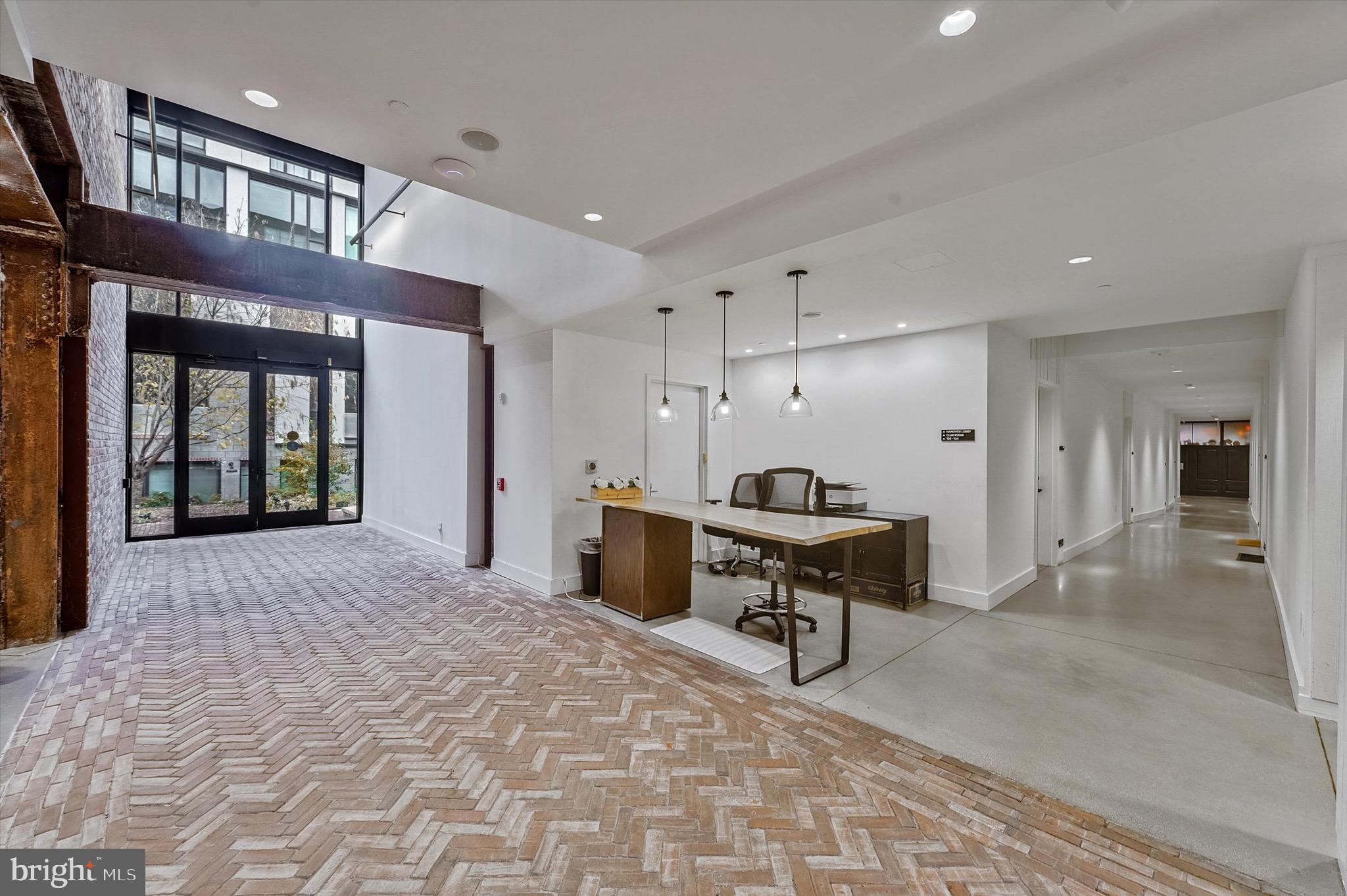 57 N Street Northwest, Unit 125 Washington, DC 20001 - Photo 4 of 56 a living room with furniture a window and a table