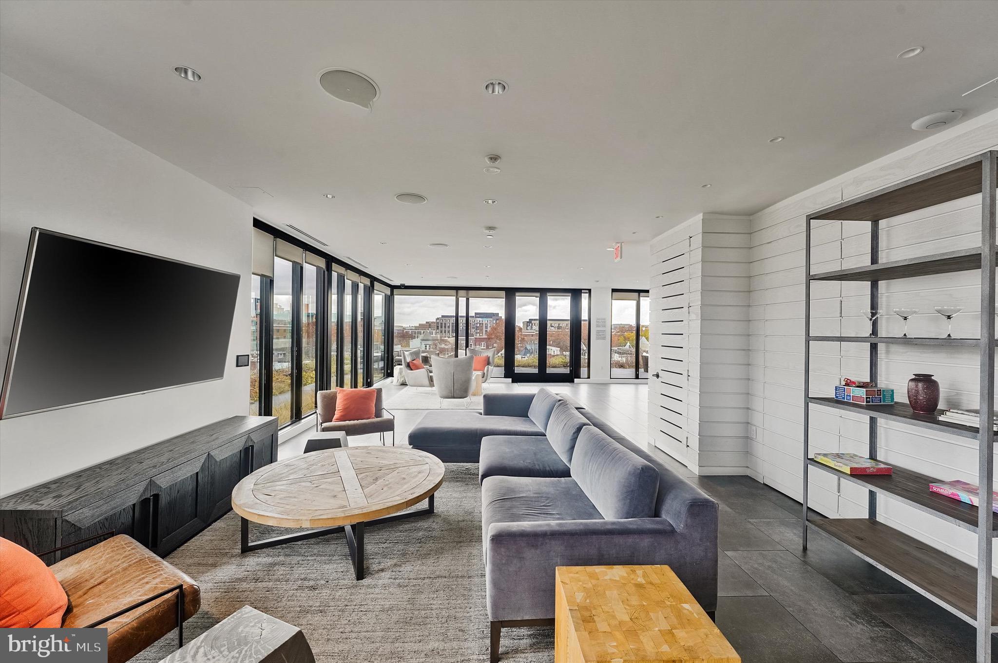 57 N Street Northwest, Unit 125 Washington, DC 20001 - Photo 44 of 56 a living room with furniture and a flat screen tv