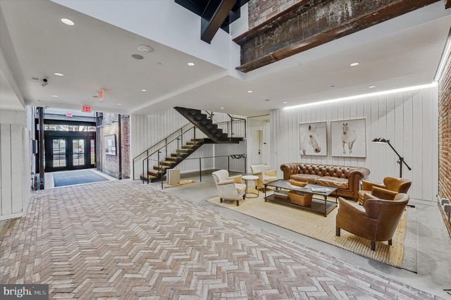 a kitchen with a refrigerator and a sink