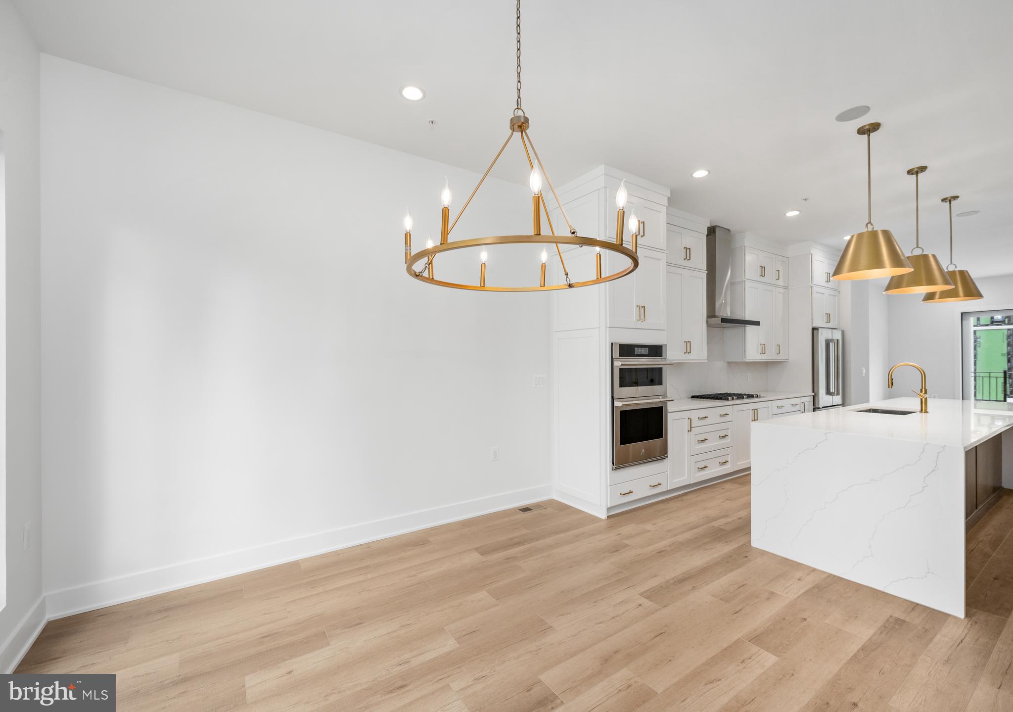 8610 Erdem Place Chevy Chase, MD 20815 - Photo 5 of 21 a kitchen with stainless steel appliances granite countertop a stove a sink and a refrigerator