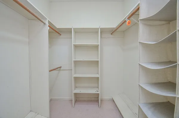 a view of an empty walk in closet