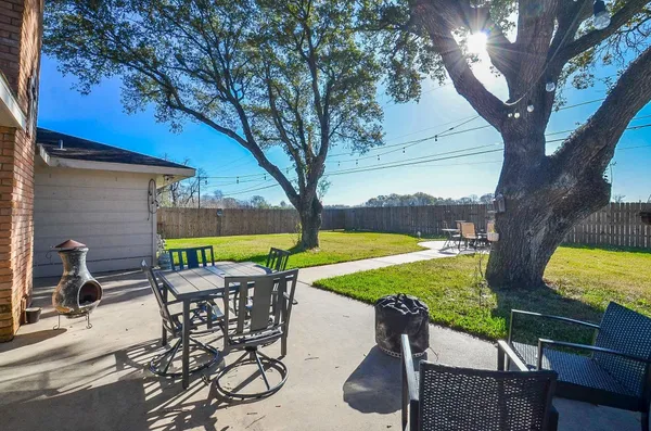 a view of a chairs and table in the patio