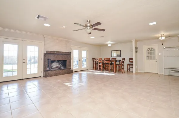 an empty room with furniture and a fireplace