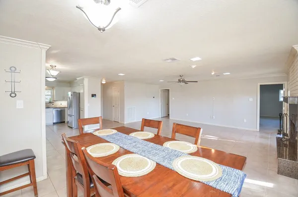 a dining room with furniture and a table