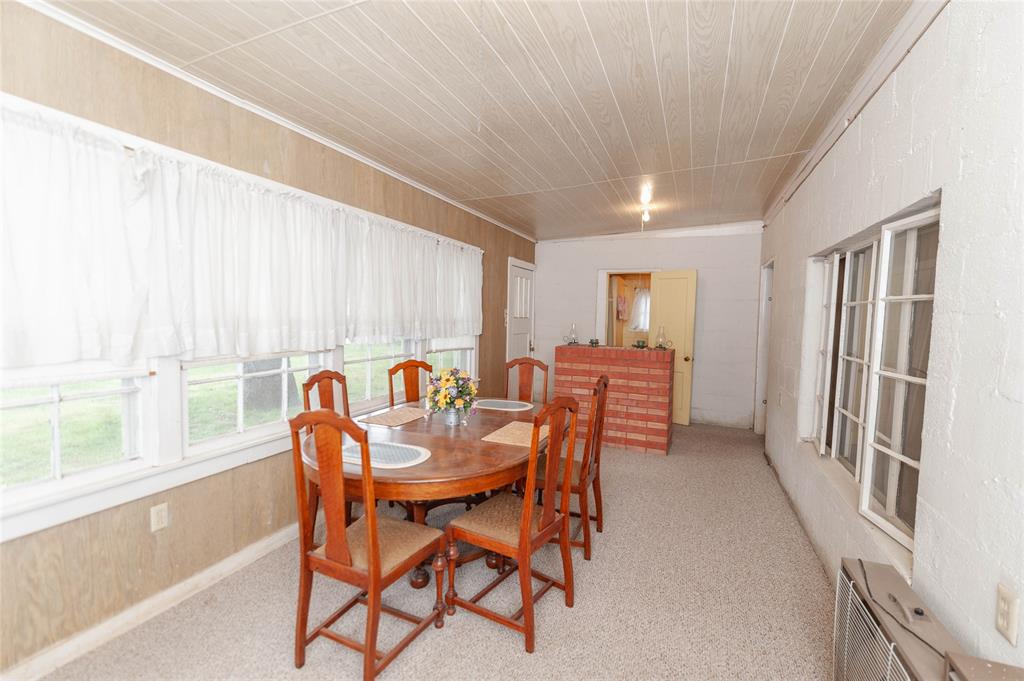 137 Center Loop Whitney, TX 76692 - Photo 19 of 33 a dining room with furniture and window