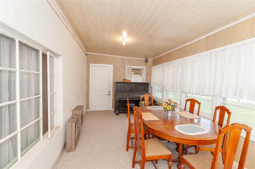 137 Center Loop Whitney, TX 76692 - Photo 20 of 33 a dining room with furniture and a fireplace