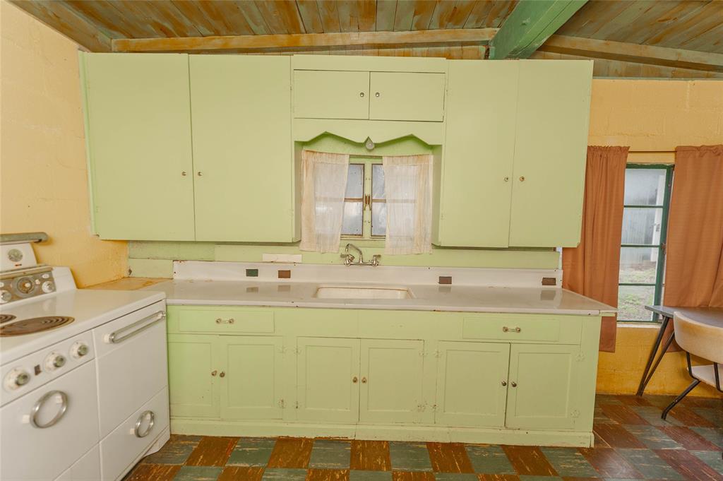 137 Center Loop Whitney, TX 76692 - Photo 26 of 33 a bathroom with a sink and a mirror