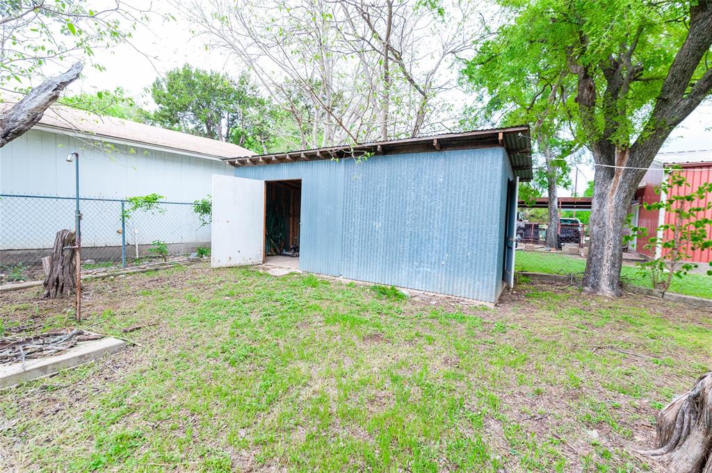 137 Center Loop Whitney, TX 76692 - Photo 28 of 33 a backyard of a house with seating space
