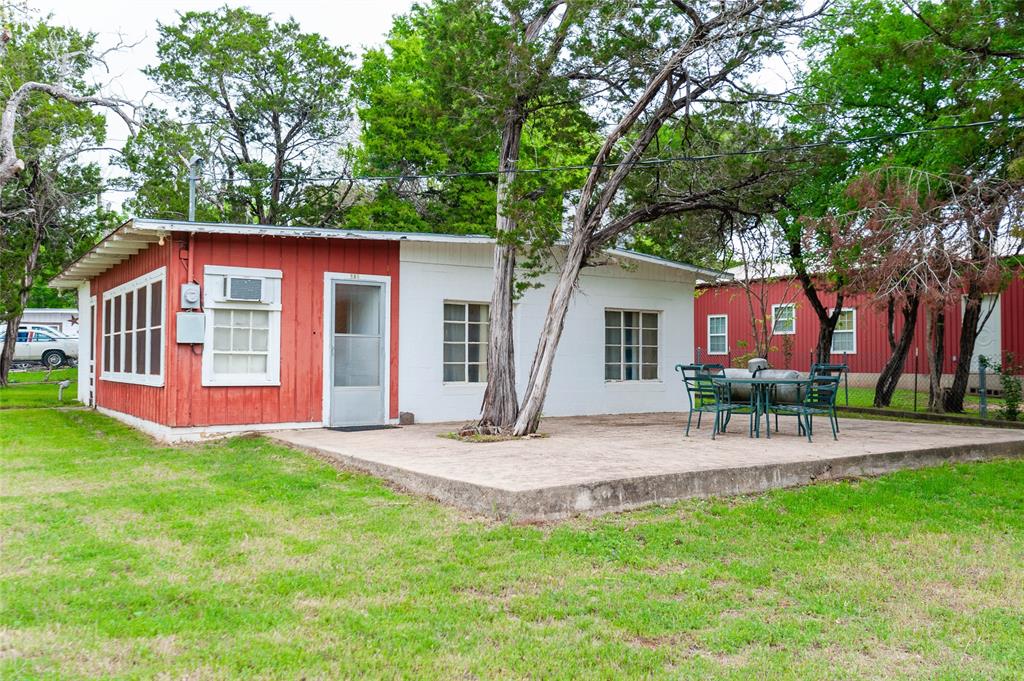 137 Center Loop Whitney, TX 76692 - Photo 6 of 33 a view of a house with a yard and tree s