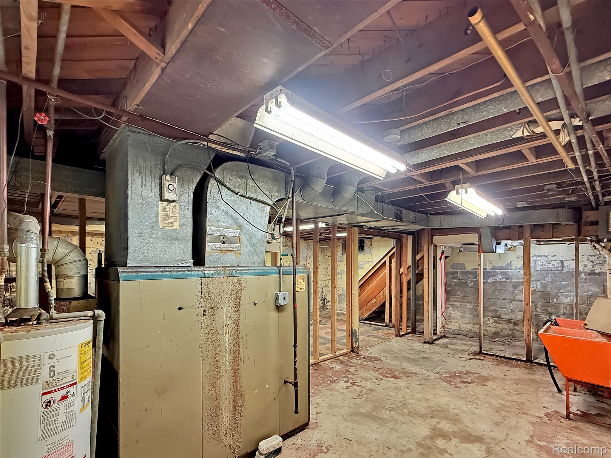 768 Washington Road Grosse Pointe, MI 48230 - Photo 26 of 54 Unfinished basement with heating unit and water heater