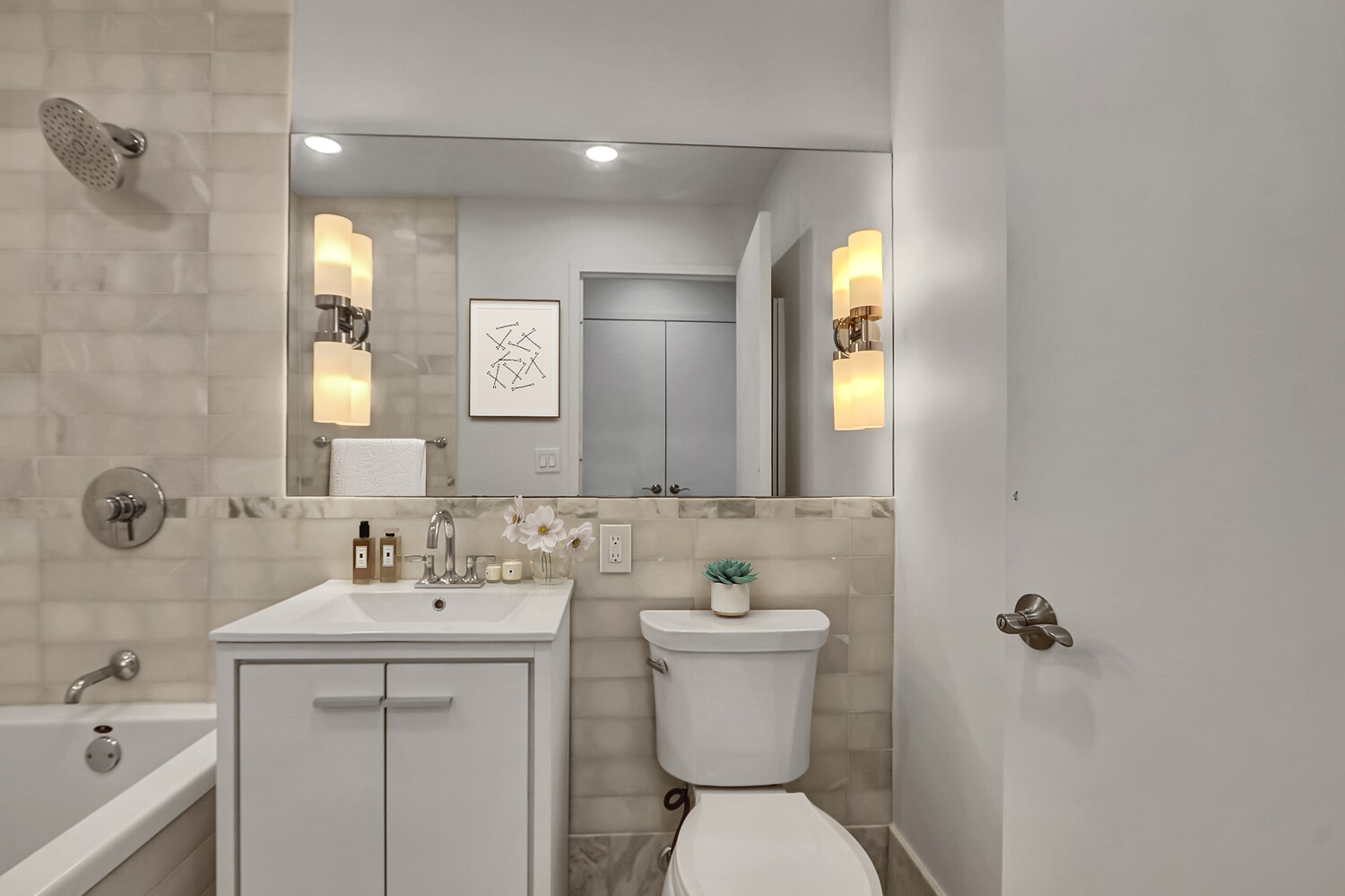 635 West 42nd Street, Unit 7A Manhattan, NY 10036 - Photo 21 of 28 a bathroom with a toilet sink and mirror