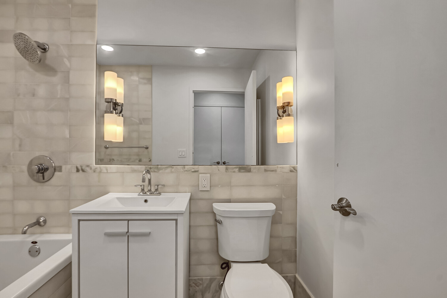 635 West 42nd Street, Unit 7A Manhattan, NY 10036 - Photo 22 of 28 a bathroom with a toilet sink and mirror