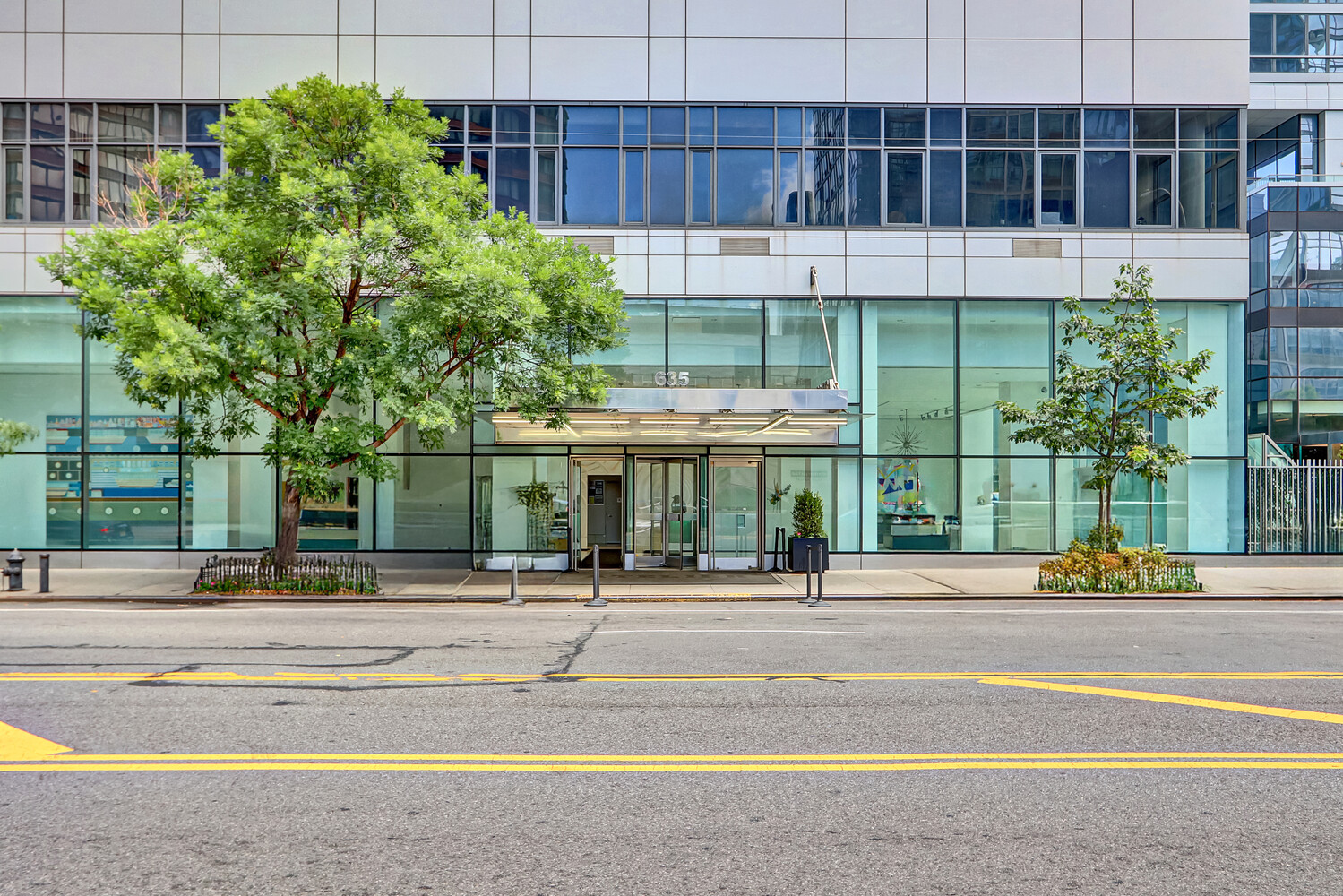 635 West 42nd Street, Unit 7A Manhattan, NY 10036 - Photo 3 of 28 a view of a building with a garden and pathway