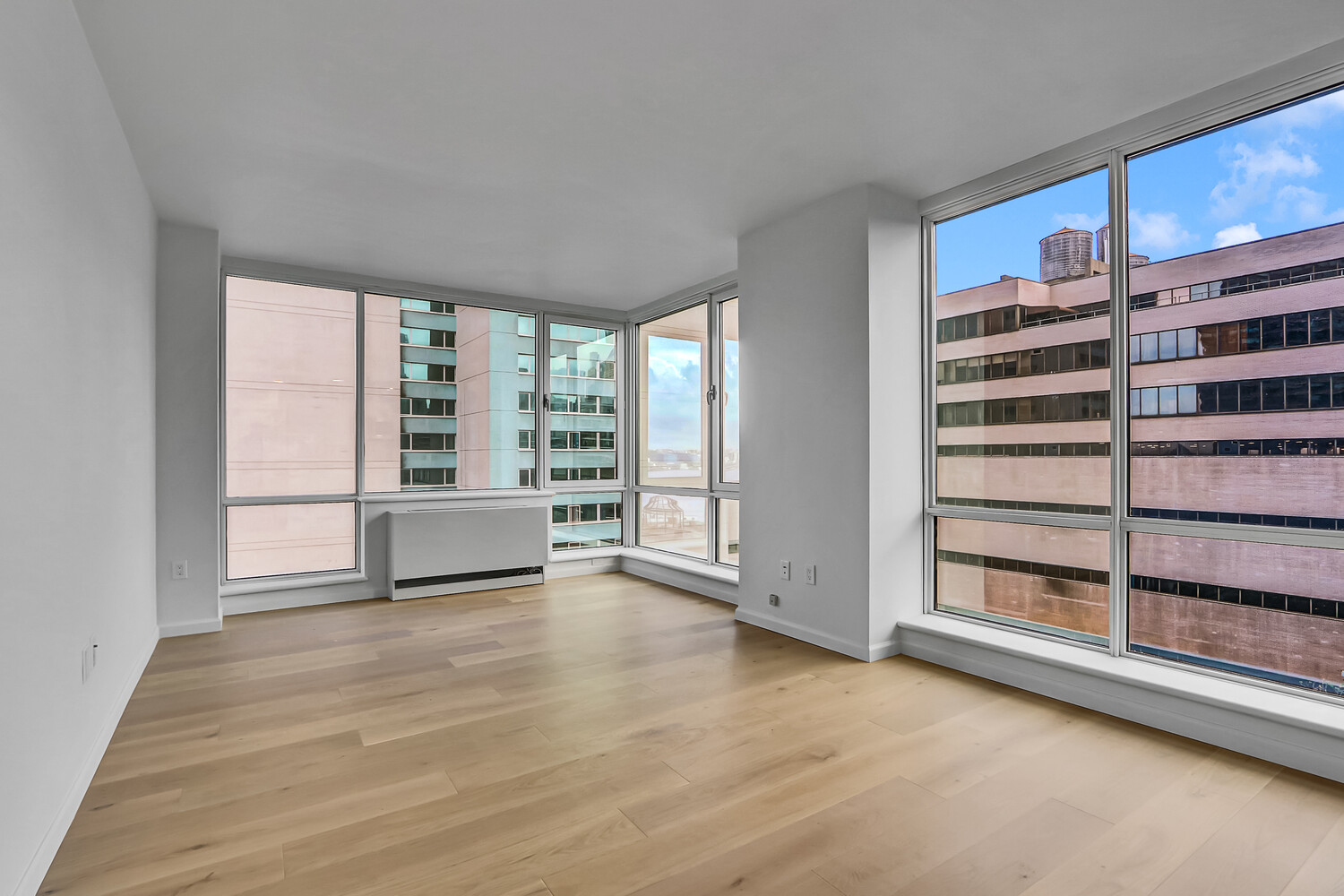 635 West 42nd Street, Unit 7A Manhattan, NY 10036 - Photo 6 of 28 a view of an empty room with a window