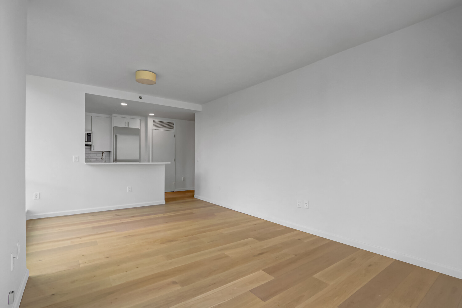 635 West 42nd Street, Unit 7A Manhattan, NY 10036 - Photo 10 of 28 a view of empty room with wooden floor