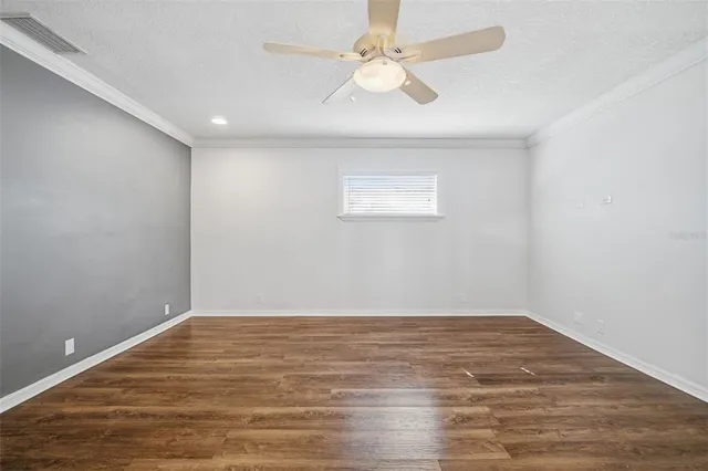 a kitchen with cabinets and stainless steel appliances