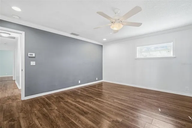 a kitchen with stainless steel appliances granite countertop a sink stove and wooden floor