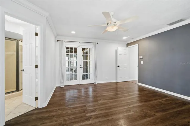 a large kitchen with kitchen island a large island wooden floor and a sink