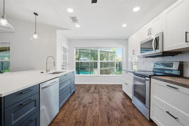 a bathroom with a sink a toilet and a shower