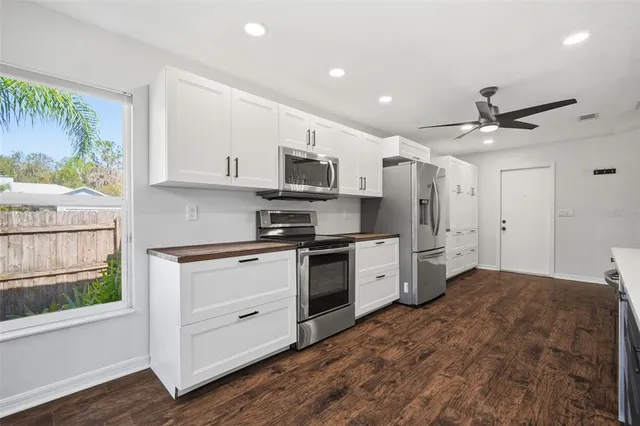 a view of a chairs and table in the patio