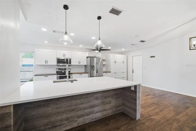 a view of a porch with furniture and garden