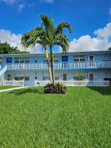 a view of a house with a garden
