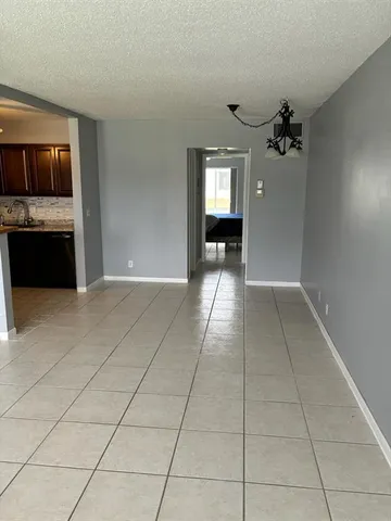 a view of a kitchen with a sink and a stove top oven