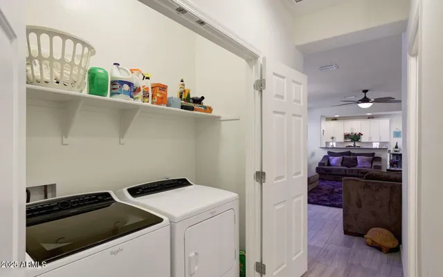 a bathroom with a granite countertop sink a toilet and a mirror