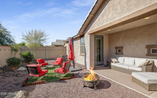 a view of storage and utility room with refrigerator and wooden floor