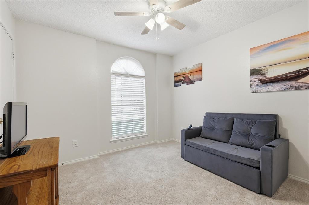 705 Squire Court Allen, TX 75002 - Photo 22 of 27 a living room with furniture and a window