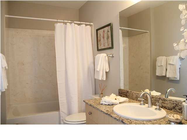 211 Durango Road, Unit 515 Destin, FL 32541 - Photo 21 of 34 a bathroom with a sink and a mirror