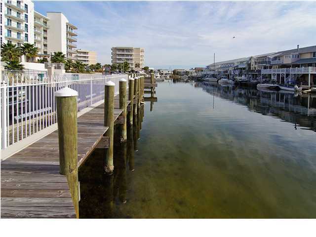 211 Durango Road, Unit 515 Destin, FL 32541 - Photo 31 of 34 a terrace with chairs and table