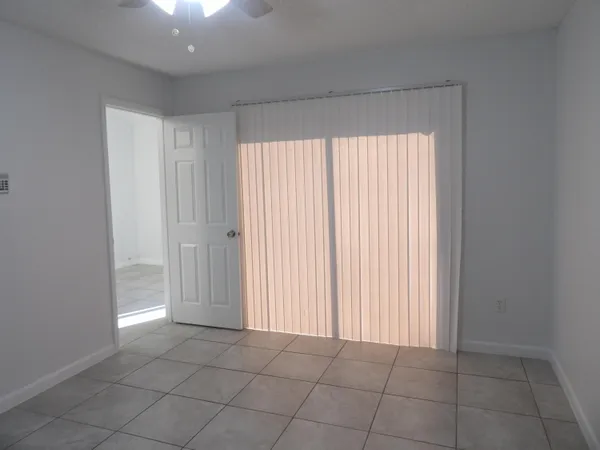 an empty room with a empty space and windows
