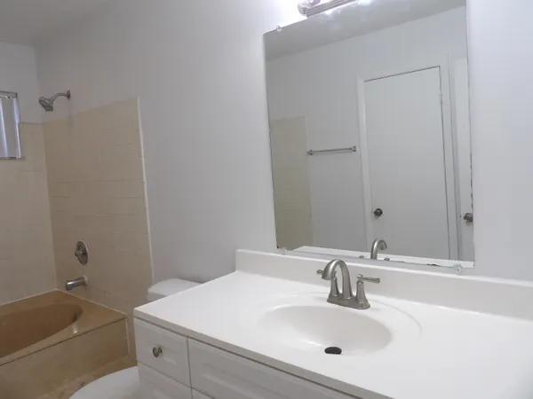a bathroom with a sink and a bathtub