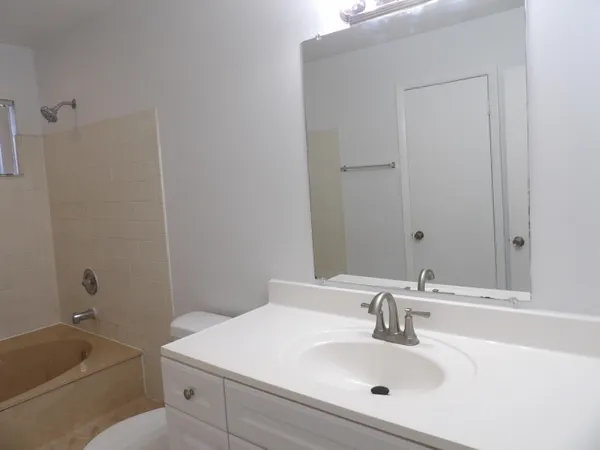 a bathroom with a sink and a bathtub