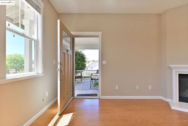 a view of a backyard with a garden and entertaining space