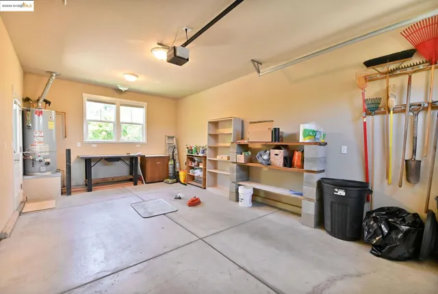 a view of a patio with table and chairs and potted plants