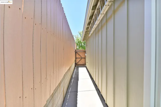a view of a street with a houses in the background