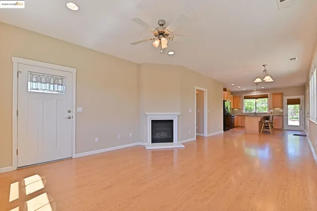 a view of an empty room with a fireplace