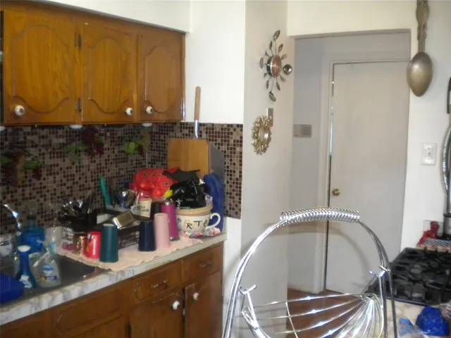 a kitchen with a sink and cabinets