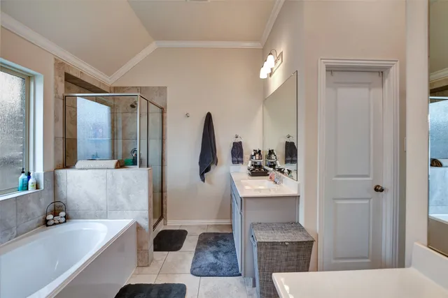 a bathroom with a bathtub and a sink