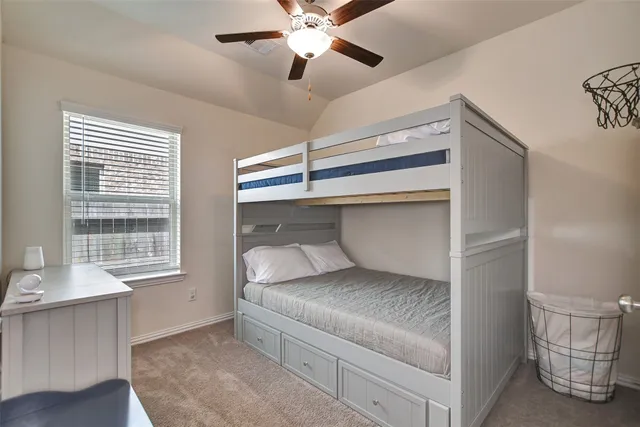 a living room with a couch and a window