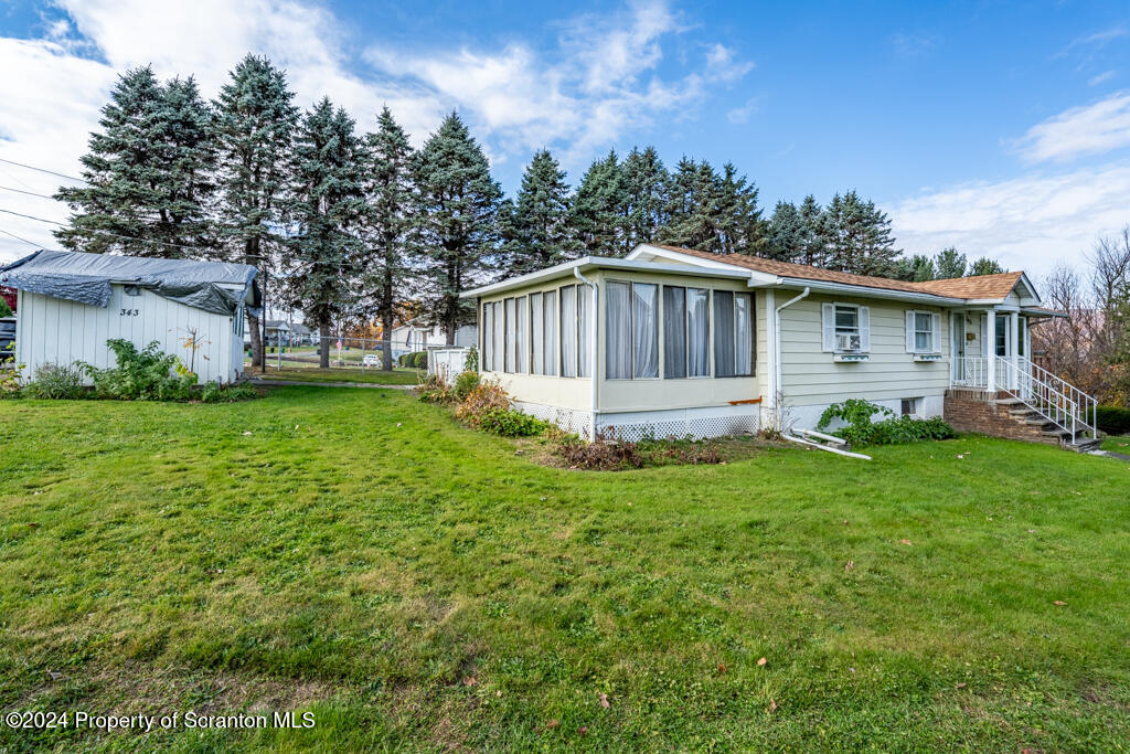 343 Atlantic Street Jessup, PA 18434 - Photo 2 of 19 a front view of house with yard and green space