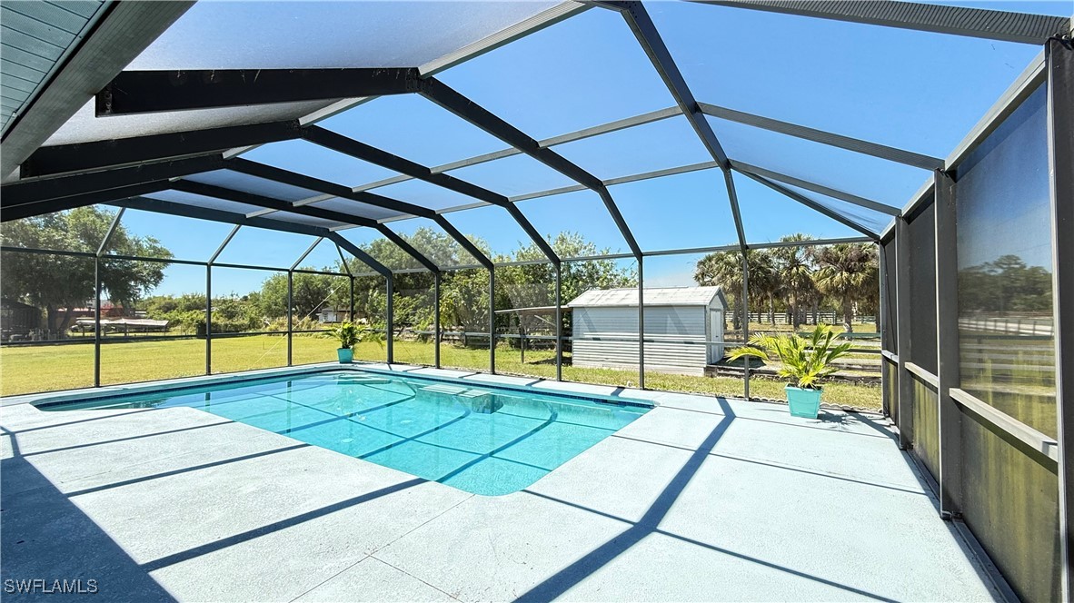 18161 Interlochen Lane Alva, FL 33920 - Photo 19 of 25 a view of swimming pool with a backyard