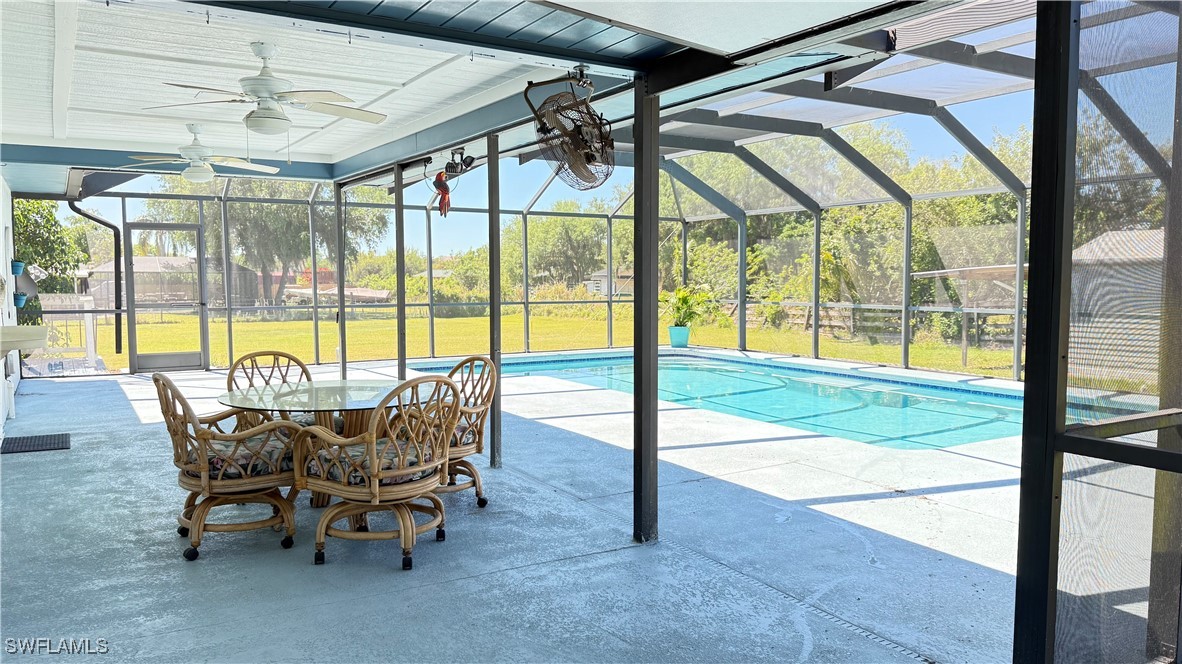 18161 Interlochen Lane Alva, FL 33920 - Photo 20 of 25 a view of a dining area with furniture and a window