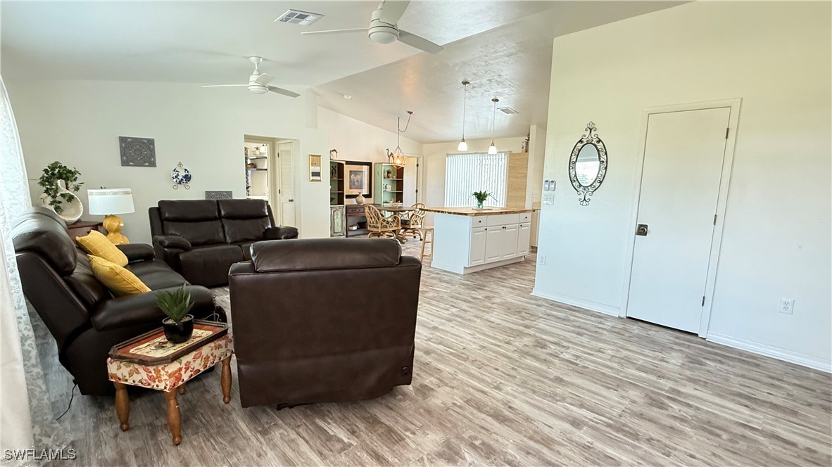 18161 Interlochen Lane Alva, FL 33920 - Photo 3 of 25 a living room with furniture and wooden floor